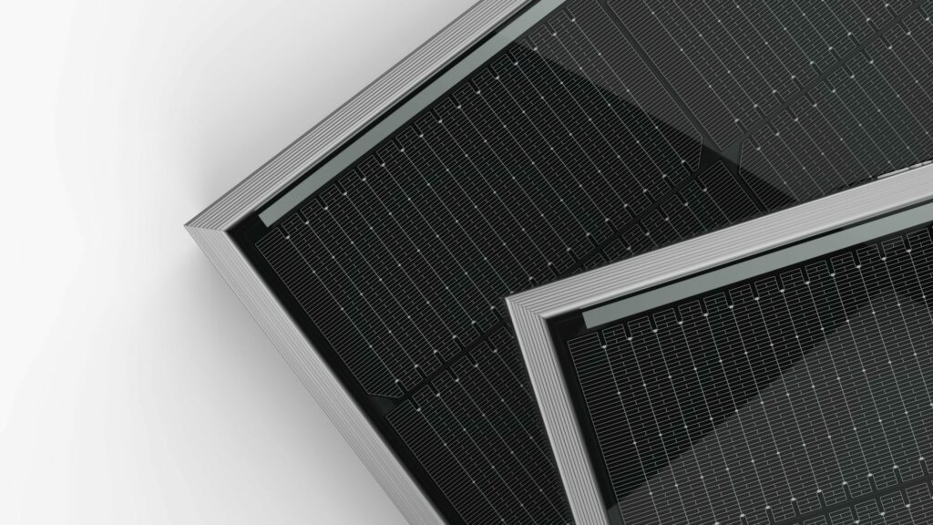 Two Jinko Tiger Neo solar panels overlapping on a white background for the article: Best Solar Panels Perth by Efficiency.