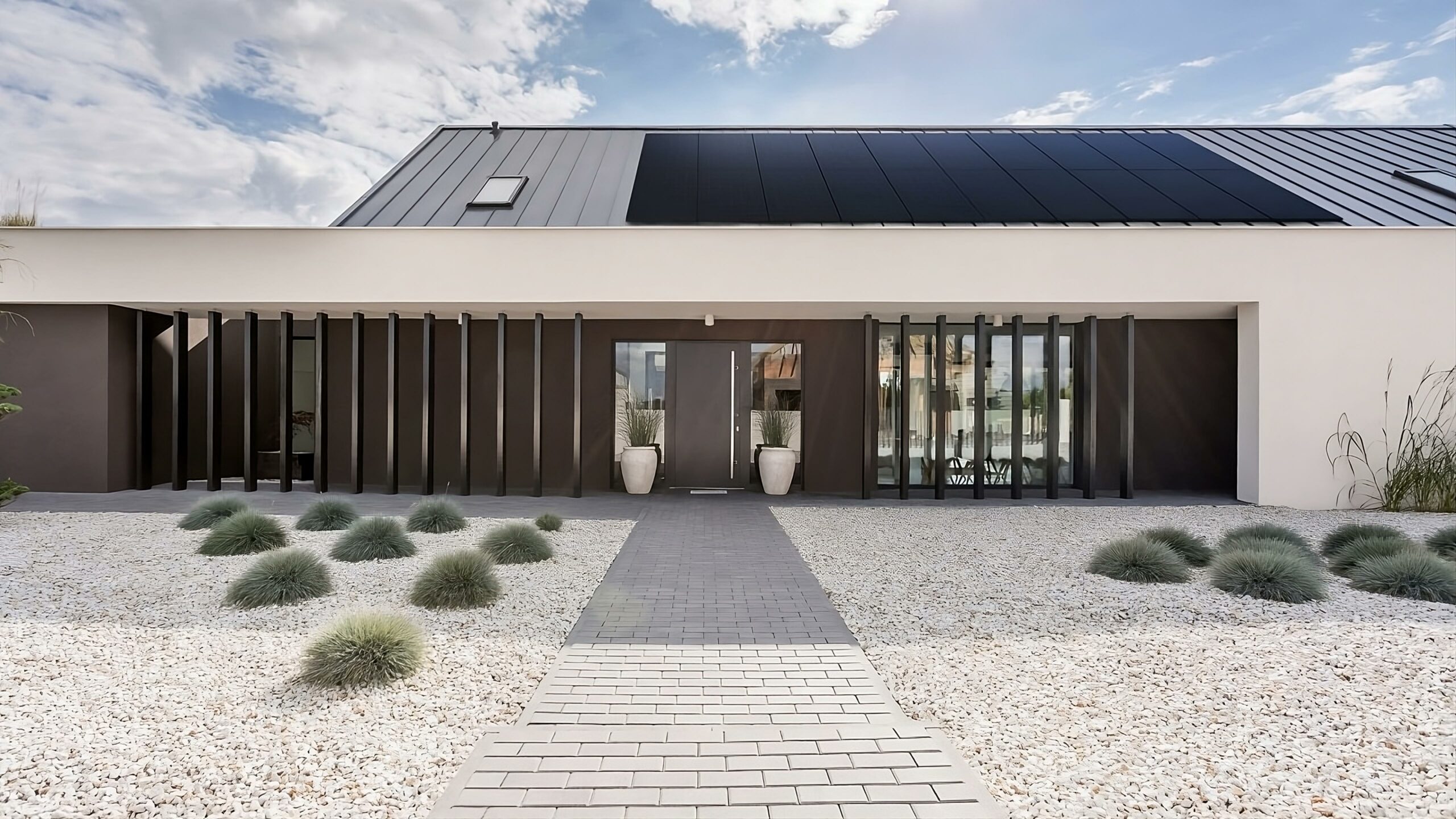 Modern villa with all-black solar panels on the roof for the article: Top 10 Solar Energy Predictions